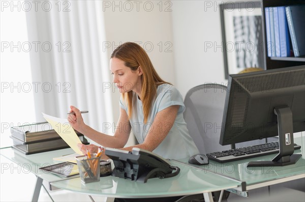 Business woman working in office.