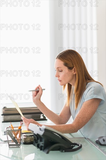 Business woman working in office.