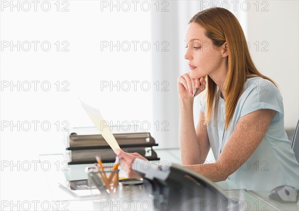 Business woman working in office.