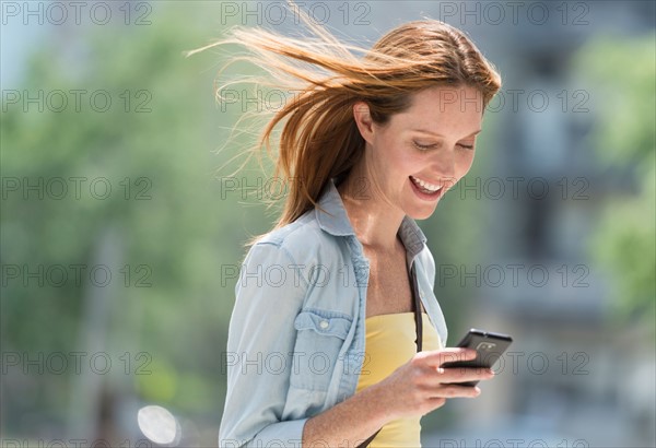 Woman using phone.