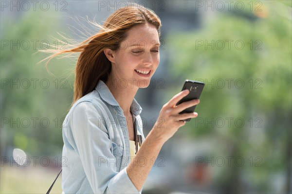 Woman using phone.