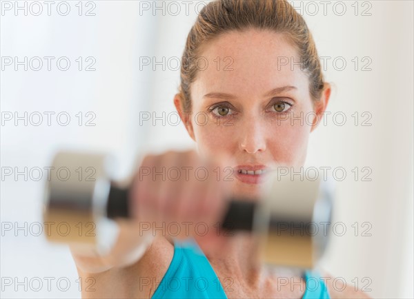 Woman exercising with weights.