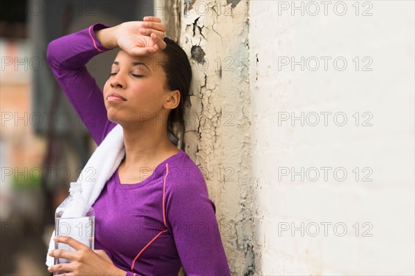 Female jogger with water bottle.