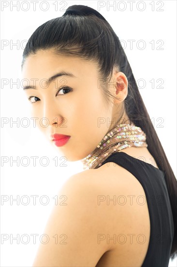 Studio portrait of young woman.