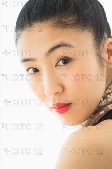 Studio portrait of young woman.