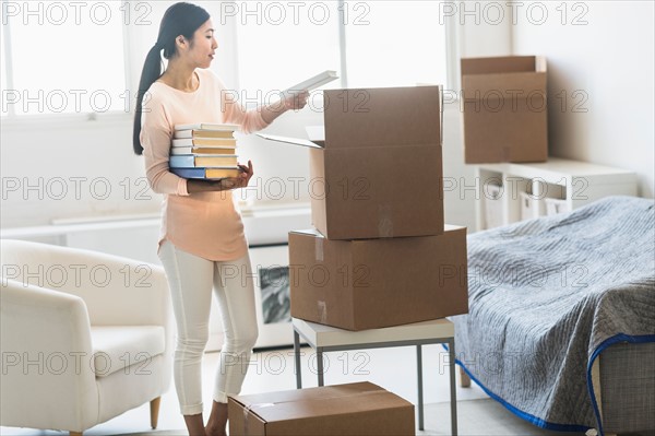 Woman moving home.