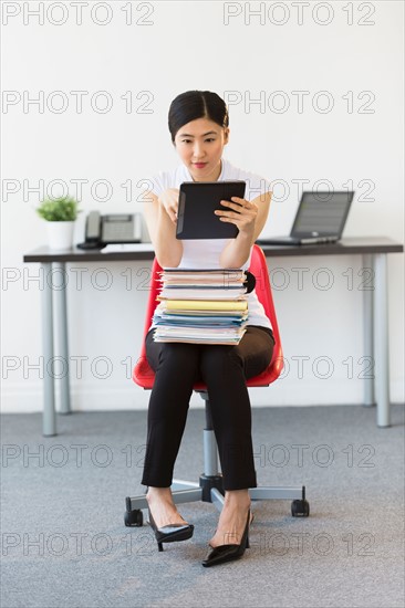 Businesswoman using tablet pc.