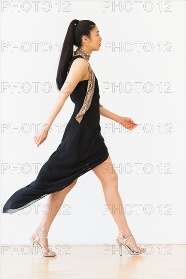 Woman wearing elegant black dress.