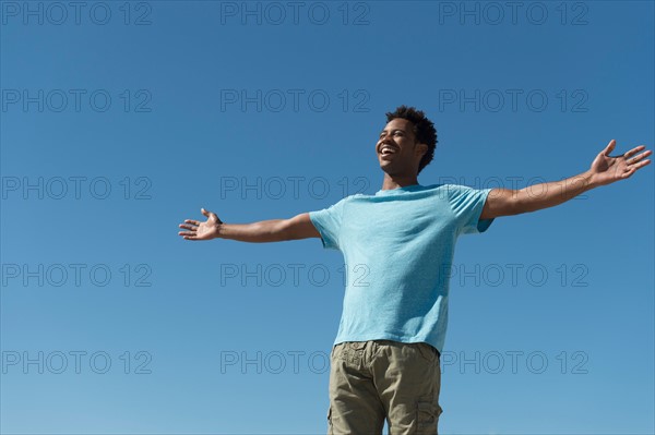 Happy man against clear sky.