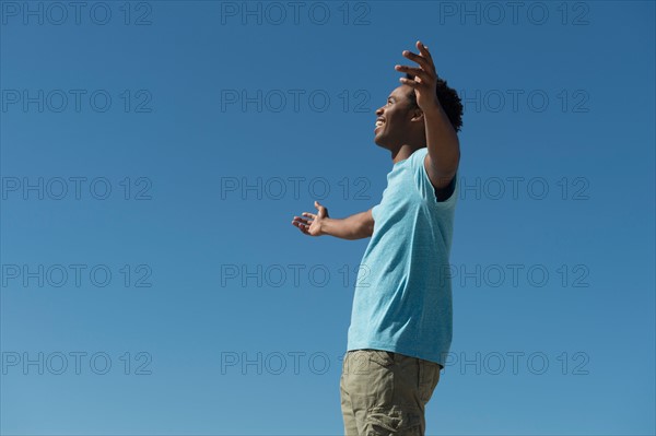 Happy man against clear sky.