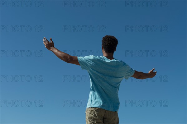 Happy man against clear sky.