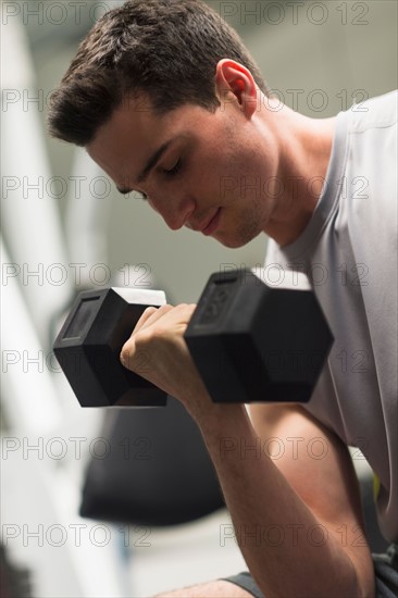 Man lifting dumbbells.