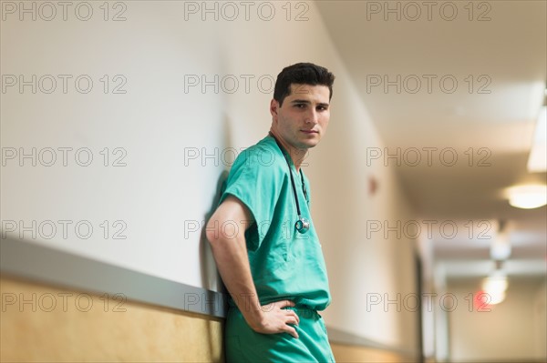 Doctor standing in hallway.