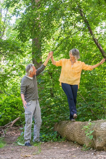 Central Park, New York City. Senior couple hiking in forest.