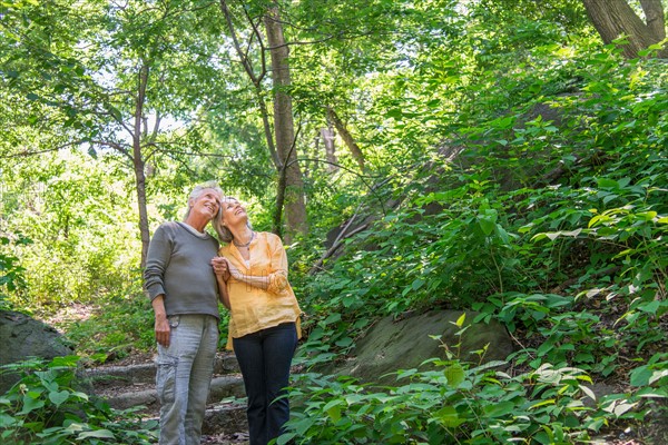 Central Park, New York City. Senior couple relaxing in park.