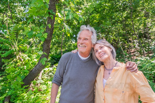 Senior couple relaxing in park.