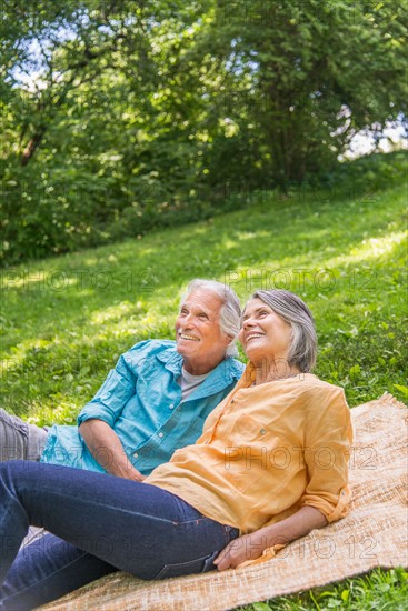 Central Park, New York City. Senior couple relaxing in park.