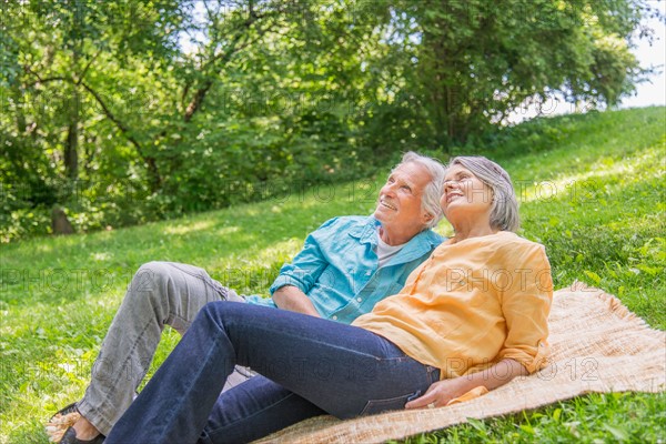 Central Park, New York City. Senior couple relaxing in park.