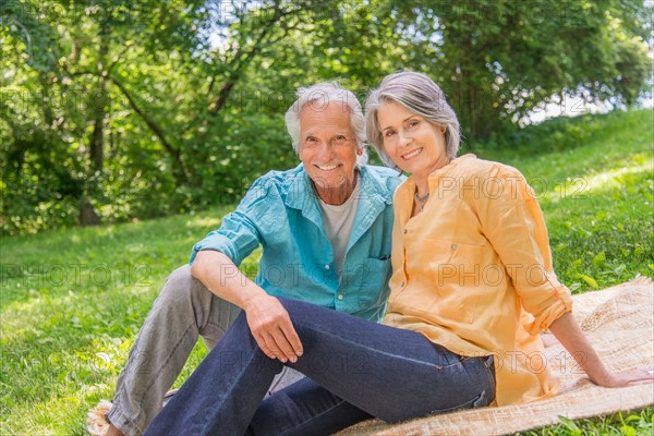 Central Park, New York City. Senior couple relaxing in park.