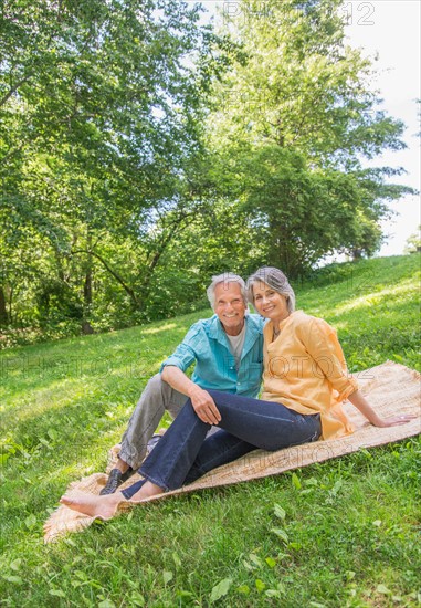 Central Park, New York City. Senior couple relaxing in park.