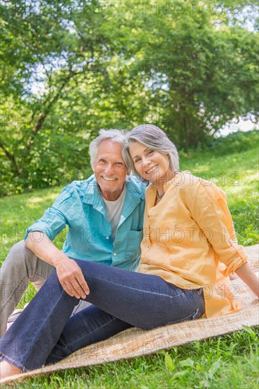 Central Park, New York City. Senior couple relaxing in park.