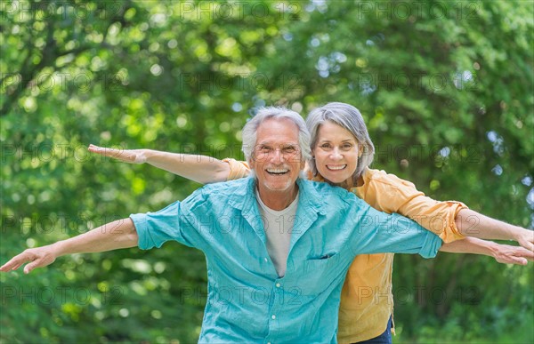 Central Park, New York City. Senior couple having fun in park.