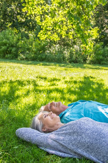 Central Park, New York City. Senior couple relaxing in park.