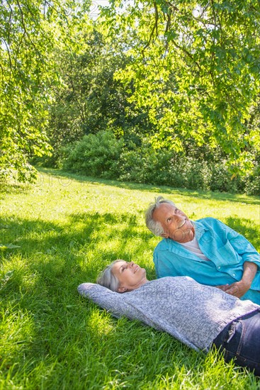 Central Park, New York City. Senior couple relaxing in park.