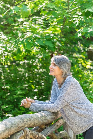 Central Park, New York City. Senior woman relaxing in park.