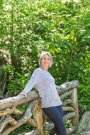 Central Park, New York City. Senior woman relaxing in park.