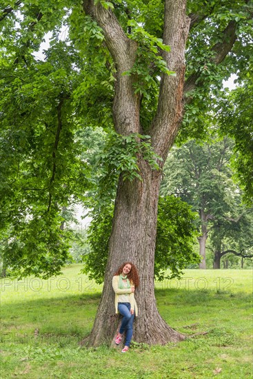 Central Park, New York City. Woman relaxing in park.