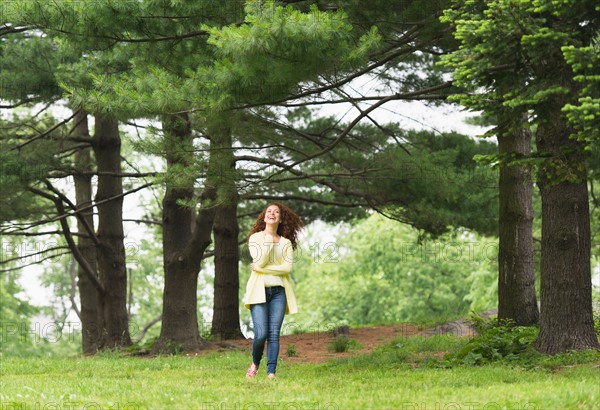 Central Park, New York City. Woman relaxing in park.