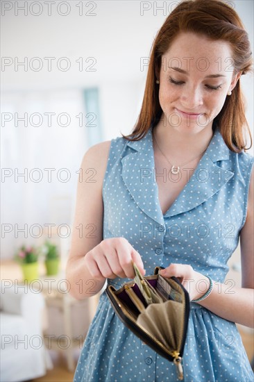 Teenage girl (14-15) with wallet