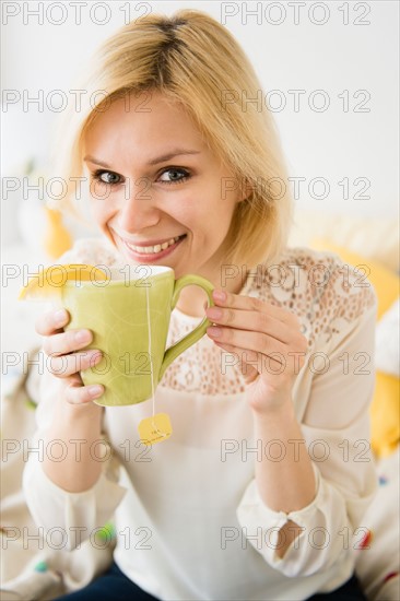 Young woman drinking tea