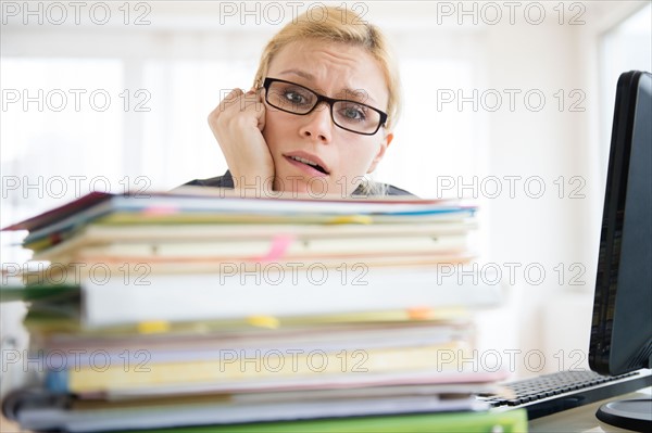 Young woman working at desk in office