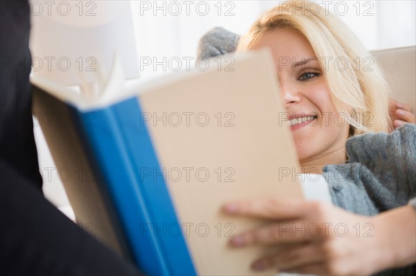 Young woman reading book