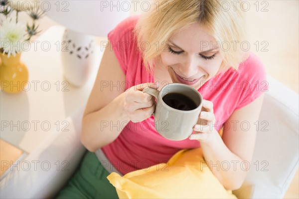 Young woman drinking coffee