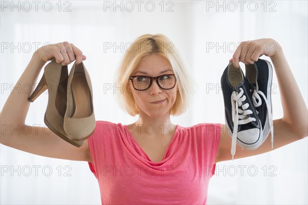 Young woman choosing shoes