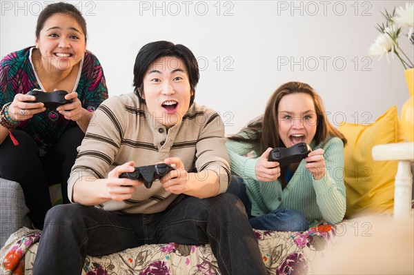 Young women and man playing video game