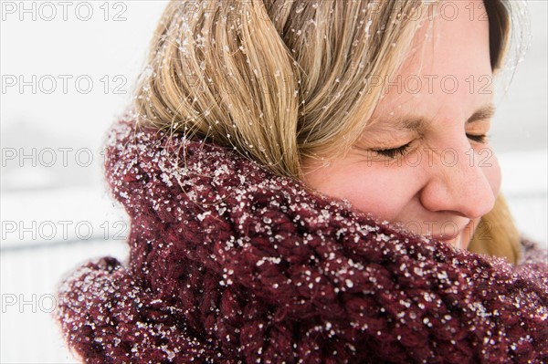 Portrait of woman wearing wooly scarf