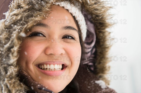 Portrait of smiling woman in warm clothing at winter