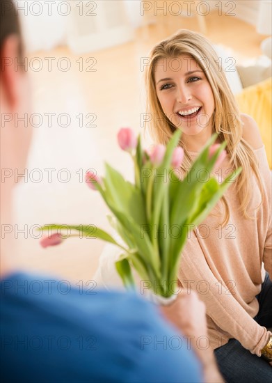 Man giving his girl flowers