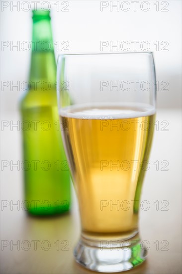 Studio shot of glass of beer and beer bottle