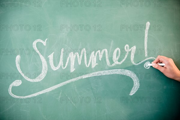 Summer' sign on blackboard