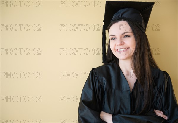 Studio shot of young graduate