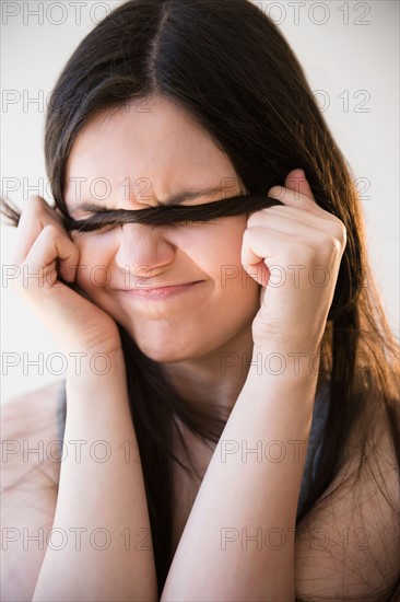 Portrait of young woman with angry face expression