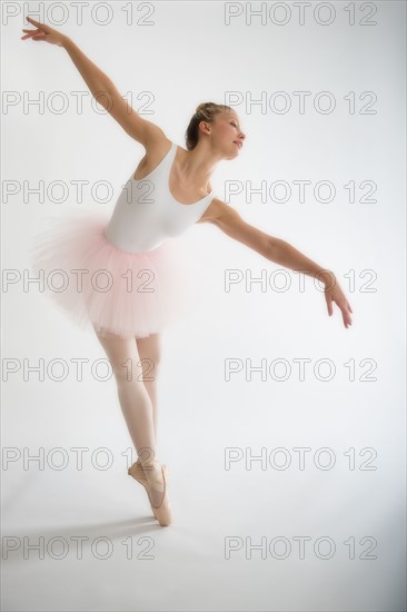 Teenage (16-17) ballerina tiptoeing