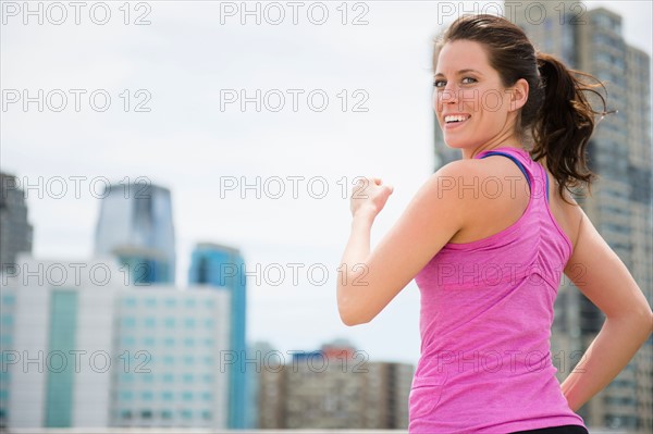 Portrait of young woman jogging