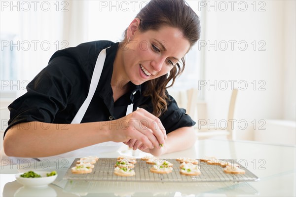 Portrait of woman preparing food