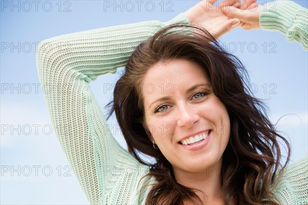 Happy woman against blue sky